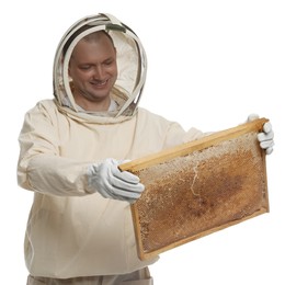 Photo of Beekeeper in uniform holding hive frame with honeycomb on white background