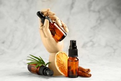 Photo of Stylish presentation of organic cosmetic products on light marbled background