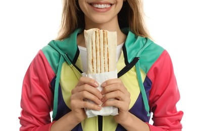 Young woman with delicious shawarma on white background, closeup
