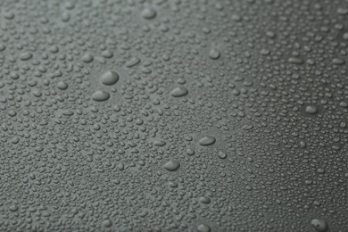 Photo of Many water drops on grey background, closeup