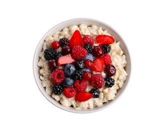 Photo of Bowl with tasty oatmeal porridge and berries on white background, top view. Healthy meal
