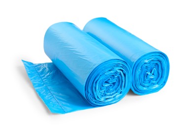 Rolls of light blue garbage bags on white background. Cleaning supplies