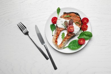 Photo of Tasty salmon steak served on white wooden table, flat lay