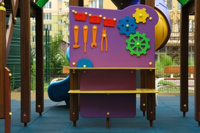 Colourful busy board on outdoor playground in residential area
