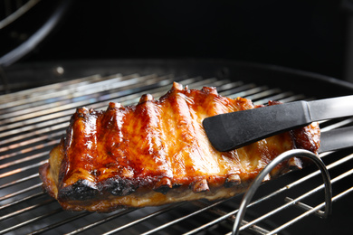Photo of Delicious ribs on barbecue grill. Yummy meat