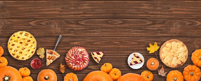 Flat lay composition with different tasty pies on wooden table. Banner design