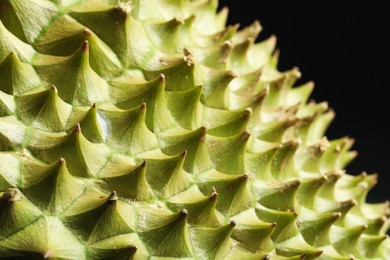 Closeup view of ripe durian on black background