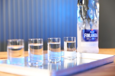 Photo of MYKOLAIV, UKRAINE - SEPTEMBER 23, 2019: Finlandia vodka on bar counter. Space for text
