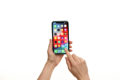 Photo of MYKOLAIV, UKRAINE - JULY 9, 2020: Woman holding  iPhone X with home screen on white background, closeup
