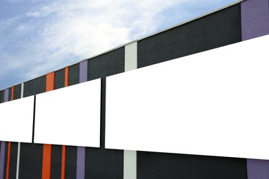 Blank advertising boards on city building. Mockup for design