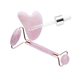 Rose quartz gua sha tool, facial roller and dropper isolated on white, top view