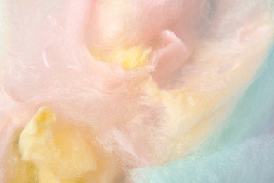 Sweet colorful cotton candy as background, closeup view