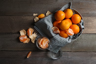 Photo of Many fresh ripe tangerines on wooden table, flat lay