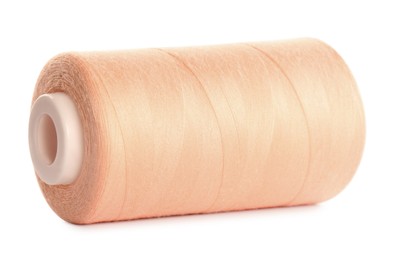 Spool of pale pink sewing thread isolated on white
