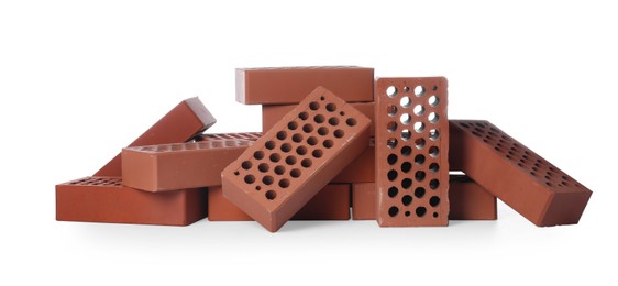 Pile of red bricks on white background. Building material