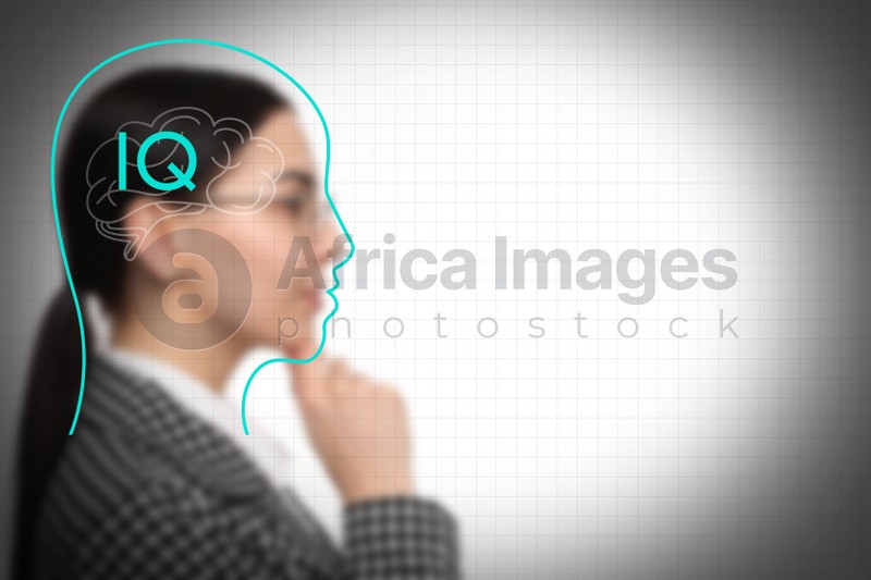 Illustrated head with brain and blurred view of woman on light background. IQ test