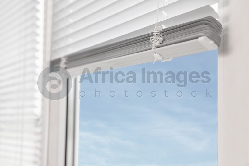 Photo of Closeup view of stylish horizontal window blinds