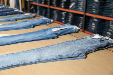 Stylish blue jeans on display in shop