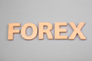 Word Forex with wooden letters on grey background, above view