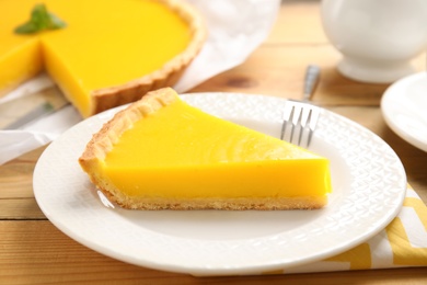 Delicious homemade lemon pie on wooden table