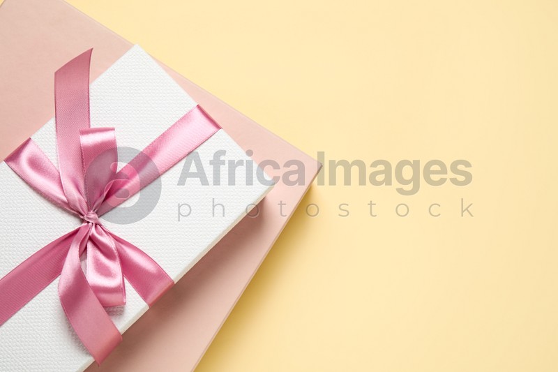 Beautiful gift boxes on beige background, top view. Space for text