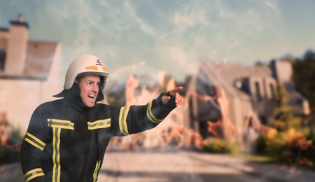 Firefighter in uniform with helmet hurrying to rescue