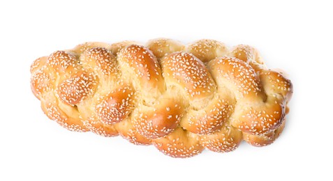 Homemade braided bread with sesame seeds isolated on white, top view. Traditional Shabbat challah