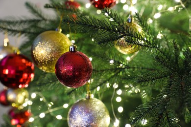 Beautifully decorated Christmas tree with baubles, closeup