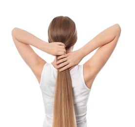 Teenage girl with strong healthy hair on white background, back view