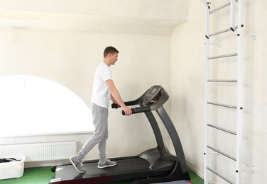 Patient training on treadmill in rehabilitation center
