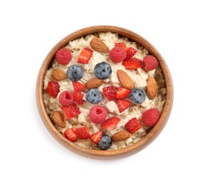 Tasty oatmeal porridge with berries and almond nuts in bowl on white background, top view