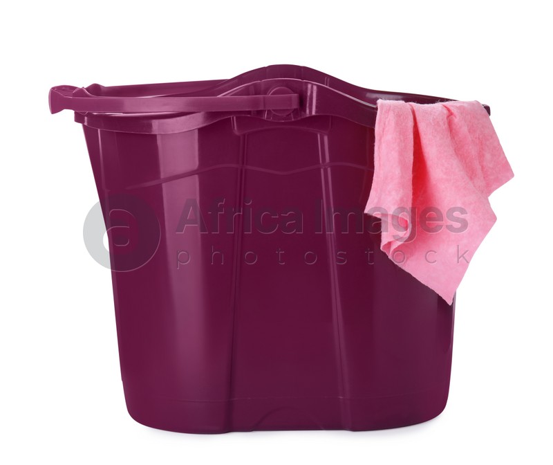 Purple bucket with rag isolated on white