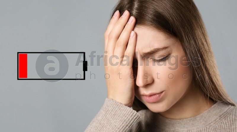Illustration of discharged battery and tired woman on light grey background. Extreme fatigue