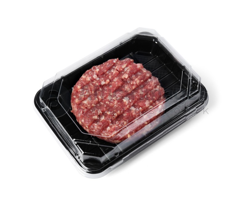 Plastic container with raw meat cutlet for burger isolated on white