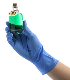 Woman in gloves holding glass bottle of poison with warning sign isolated on white, closeup