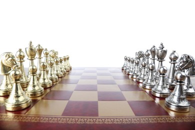 Chess pieces on wooden board against white background