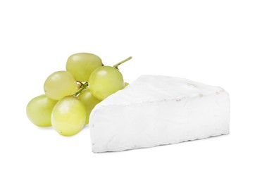 Tasty brie cheese with grapes on white background