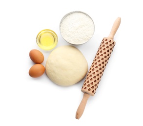 Raw dough and ingredients on white background, top view
