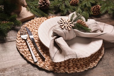Photo of Luxury place setting with beautiful festive decor for Christmas dinner on wooden table, closeup