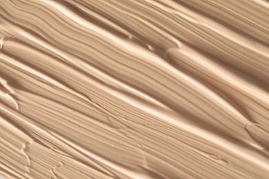 Texture of liquid skin foundation as background, closeup