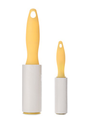 Different lint rollers with yellow handles isolated on white