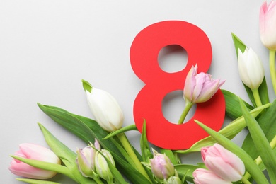 8 March card design with tulips on light grey background, flat lay. International Women's Day