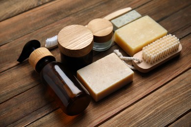 Eco friendly personal care products on wooden table, closeup