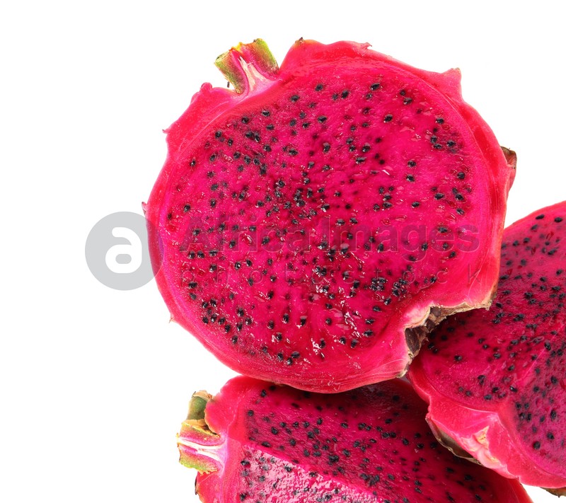 Photo of Delicious cut red pitahaya fruit on white background, top view