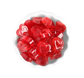 Sweet heart shaped jelly candies in bowl isolated on white, top view