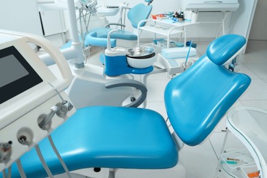 Dentist's office interior with chair and modern equipment