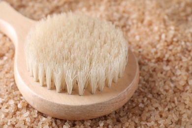 Salt for spa scrubbing procedure and brush, closeup