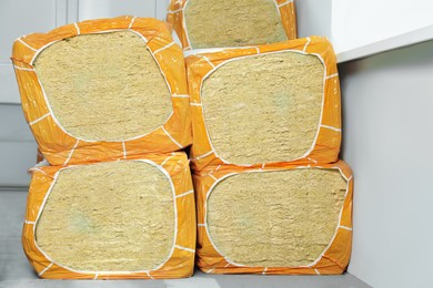Photo of Packages of thermal insulation material in room