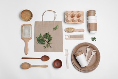 Photo of Different eco items on white background, flat lay. Recycling concept