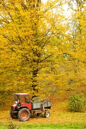 View of tractor in forest on autumn day